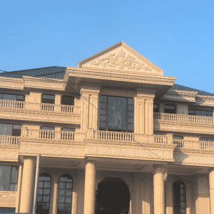 衡阳黄金麻别墅外墙干挂石材效果示例